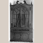 Fig. 55: Corner cupboard attributed to Mordecai Collins and possibly Jacob Clodfelter, ca. 1810, Davidson Co., NC. Walnut, with walnut, yellow pine, and light- and dark-wood inlay; HOA: 99" (with alterations), WOA: 49", DOA: NR. Private collection. MESDA Object Database file S-11675.