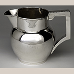Fig. 10: Pitcher marked by Asa Blanchard (with manufacturer mark of John McMullin, Philadelphia, PA), ca. 1815, Lexington, KY. Silver; HOA: 7”, WOA: 8-1/2”, DOA: 6-1/2”. Private Collection; Photograph courtesy of the Kentucky Online Arts Resource (The Speed Art Museum), 2011.34.10. Photograph by Bill Roughen.