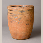 Fig. 10: Earthenware crock with lead-glazed interior attributed to Abraham Spencer working in Solomon Bell’s pottery, 1850-1873, Strasburg, VA. Stamped “SOLOMON BELL / STRASBURG, VA” and incised with an “A” on outside of body. Private collection.