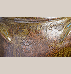 Fig. 17: Detail of the inscription "May 13, 1859 / Dave + / Baddler;" on an alkaline-glazed stoneware storage jar by David Drake and Baddler, 1859, Edgefield District, SC. Also inscribed “Made at Stoney bluff, for making dis ole gin enuff.” HOA: 28-3/4”, DIA: 21-3/4”. Charleston Museum, Acc. 1919.5.1.
