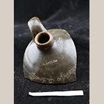 Fig. 18: Alkaline-glazed stoneware jug sherd impressed with "L.MILES" stamp and incised "Dave & Abram,” Stony Bluff Pottery. Private collection.