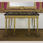 Fig. 10: Side table; tabletop John Wildsmith (w.1757–1769), London, England, 1759, base by John Mayhew (1736–1811), London, England, 1794. Carved and gilded pine with marbles (including rosso and nero antico, orange Veronese, yellow Siena, brown, gray, and white fleur de pêcher, black and gold Portor, orange and violet Spanish brocatello, and white Carrara, and hardstones, including gray and red granite, red and white jasper, pink quartz, porphyry, bloodstone, serpentine, golden and brown agate and onyx, and lapis lazuli); HOA: 37", WOA: 60-1/4", DOA: 31-1/8". Collection of the Metropolitan Museum of Art, Acc. 58.75.130a, b; Gift of Samuel H. Kress Foundation.