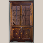 Fig. 7: Corner cupboard attributed to the shop of Hugh McAdams, 1800–1815, Washington Co., TN. Walnut with tulip poplar and lightwood inlay (probably holly); HOA: 87-3/4”, WOA: 40-3/4”. Private collection; MESDA Object Database file S-11859.