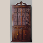 Fig. 43: Corner cupboard, 1805–1815, Washington Co. or Greene Co., TN. Walnut with darkwood and lightwood inlay (secondary wood not recorded); HOA: 96-7/8”, WOA: 43”. Private collection; MESDA Object Database file S-13028.