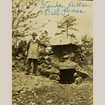 Fig. 13 "Grandpa Potter Bill James"; early twentieth century. Photograph. Image courtesy of John Graham Williard. William Franklin James, or Potter Bill by those who knew him, stands by his pottery kiln. Originally located along Farmington Road, the furnace appears to be an updraft furnace built of stone. Since Potter Bill was trained by his father, who seems to have learned the trade in Huntsville, the kilns used by the Jameses may have been similarly constructed.