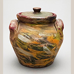 Fig. 15 Lidded jar by William Franklin James; Farmington, Davie County, NC; ca. 1870-1939. Unglazed, cold-painted earthenware; HOA 6 1/4˝. Author’s collection. Photograph by the author. Perhaps for economic reasons, much of James’ pottery is painted rather than glazed.