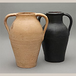 Fig. 22 Tall storage jars attributed to William F. James; Farmington, Davie County, NC; ca. 1870-1939. Earthenware with painted exteriors, black-painted jar is lead-glazed inside; HOA 14 1/2˝ (brown storage jar); HOA 14˝ (black storage jar). Author’s collection. Photograph by the author.