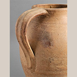 Fig. 23 Handle detail; James Pottery; Farmington, Davie County, NC; ca. 1870-1930. Unglazed earthenware. Author’s collection. Photograph by the author. Storage jar handles applied to vessels attributed to William F. James and perhaps other family potters are typically attached to jar rims and often exhibit distinctive finger-made ridges and channels as shown in this example.