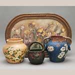 Fig. 24 Painted vessels attributed to William F. James, Farmington, Davie County, NC; ca. 1900-1939. Earthenware, the ring-handled jar is lead-glazed inside; HOA 7 3/4˝ (brown vessel); HOA 7˝ (black vessel); HOA 7˝ (blue vessel). Author’s collection. Photograph by the author. James employed at least two neighborhood women who painted some of his pottery’s unglazed surfaces before they were sold, including Bertha Johnson, who made the painting seen here for Selma Lakey in 1927.