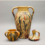 Fig. 26 Painted vessels attributed to William F. James, Farmington, Davie County, NC; ca. 1900-1939. Bisque-fired earthenware with marbled or “float-painted” surfaces; HOA 4˝ (left); HOA 13 3/4˝ (center); HOA 4˝(right). Author’s collection. Photograph by the author. Marbling typically involves floating paint on the surface of a tub of water. Colorful patterns appear on the pottery when it is dipped and swirled into the water through the various colored paint splotches. James may have employed this process himself.