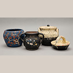 Fig. 27 Painted vessels attributed to William F. James, Farmington, Davie County, NC; ca. 1900-1939. Earthenware, bisque-fired with cold-painted surfaces, the lidded jar is lead-glazed inside; HOA 4˝ (blue vessel); HOA 4" (black vessel); HOA 4 ½” (lidded black and white vessel); HOA 3˝ (small black and white vessel). Author’s collection. Photograph by the author.