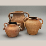 Fig. 28 Ring-handled jars attributed to William F. James, Farmington, Davie County, NC; ca. 1870-1939. Earthenware, the two smaller examples are lead-glazed inside; HOA 7 3/4˝ (left); HOA 9 1/4˝ (center); HOA 6˝(right). Author’s collection. Photograph by the author. The donut-shaped rings suspended from rim-attached handles seen on these vessels are a signature of James’ storage jar style.