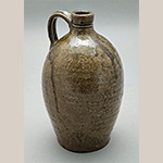 Fig. 35 Jug attributed to Thomas Ritchie; Lincoln or Catawba County, NC; ca. 1850-1860. Alkaline-glazed stoneware; HOA 8 1/2˝. Author’s collection. Photograph by the author. Moses Ritchie and his wife Susannah Hill had four sons before leaving Huntsville for the Catawba Valley, where he made pottery. One died young, and three others, Thomas, Henry, and Joseph, became notable Catawba Valley potters.