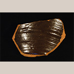 Fig. 36 Storage crock base fragment by an unknown maker; Huntsville, Yadkin County, NC; ca. nineteenth century. Lead-glazed earthenware. Private collection. Photograph by the author. Unless otherwise indicated, all pottery sherds shown in this article were surface collected by private property owners.