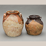 Fig. 52 Storage jars by an unknown maker; Piedmont Region, NC; ca. nineteenth century. Lead-glazed earthenware. HOA 10˝ (left); HOA 8˝ (right). Author’s collection. Photograph by the author. Several jars glazed in this crisscross fashion have been observed in private North Carolina collections. The glazing technique, perhaps gained from North Carolina’s Quaker pottery tradition, may associate these vessels with the larger jar in figure 51.