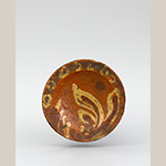 Fig. 56 Child’s dish by an unknown maker; Piedmont Region, possibly Yadkin County, NC; ca. nineteenth century. Slip-trailed decorated lead-glazed earthenware; DOA 4 3/16˝. Private collection. Photo courtesy of Old Salem Museums & Gardens. This miniature dish is associated with one of Yadkin County’s early Williams families. Collected sherds show that slip-decorated ware was made in Huntsville. Further historical and archaeological research may confirm the origin of this dish and other locally collected and unsigned earthenware examples like those in figures 57-60.