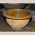 Fig. 58 Bowl by an unknown maker; Piedmont Region, possibly Yadkin County, NC; ca. nineteenth century. Lead-glazed earthenware; HOA 5˝(est.). Private Collection; Ex. Beckerdite Collection. Photograph by the author. This bowl was purchased at an estate sale on Forbush Road in Yadkin County, NC, with other earthenware, including a slip-trailed decorated dish.