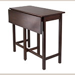 Fig. 34: “Lynnwood” drop-leaf high table by Winsome. Solid wood in antique walnut finish; HOA: 35-7/16”, WOA: 39-1/3”, DOA: 20-3/4” (closed), 30” (open).