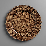 Fig. 14: Tortoiseshell plate, attributed to the factory of Thomas Whieldon, 1760–1780, Staffordshire, England. Creamware with brown tortoiseshell exterior and feather-edge rim; HOA: 13/16”, DIA: 9-5/8”. MESDA, Acc. 2224.14. Gift of Frank L. Horton.
