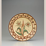 Fig. 24: Dish, shop of Rudolph Christ, 1790–1810, Salem, NC. Lead-glazed earthenware; DIA: 12-9/16”. Old Salem Museums & Gardens, Wachovia Historical Society, Acc. P-87.2. Photograph by Gavin Ashworth.