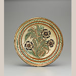 Fig. 25: Dish, shop of Gottfried Aust, 1775–1785, Salem, NC. Lead-glazed earthenware; DIA: 14”. Old Salem Museums & Gardens, Acc. 2073.16. Gift of the Katherine Hanes estate. Photograph by Gavin Ashworth.