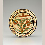 Fig. 32: Dish, shop of Friedrich Rothrock, 1793–1800, Friedberg, NC. Lead-glazed earthenware; DIA: 11-1/2”, HOA: 2-1/4”. Old Salem Museums & Gardens, Acc. 89.51. Gift of Frank L. Horton. Photograph by Gavin Ashworth.