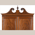 Fig. 15: Detail of pediment and upper case of the secretary wardrobe illustrated in Fig. 1. Photograph courtesy of Brunk Auctions, Asheville, NC.