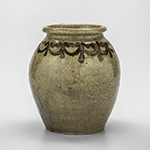 Fig. 16: Jar, Thomas Mitchel Chandler Jr., 1836–1840, Edgefield Co., SC. Alkaline-glazed stoneware with slip decoration; HOA: 7-1/4", DIA: 4-1/2" (at top). MESDA, Acc. 1054.7.