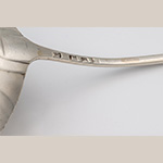 Fig. 4 James Tookey’s mark on ladle illustrated in Figure 3. James Tookey’s smallworker mark, “I * T”, is clearly rendered on the silver ladle, along with the lion passant marker certifying quality, the London crowned leopard’s head town mark, and the date letter for 1766/67. A later French import stamp is also visible, a remnant from the Read ownership of the ladle.