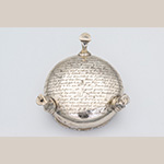 Fig. 10 Underside of one of the silver salts illustrated in Figure 9, acc. 1978-32-1. Muns used “E M” as her mark, and though she may have been widowed when she registered, she did not use the lozenge mark that signified English widows. The Skelton monogram with the four-pointed diamond decoration between the letters is also visible through the later inscription, made under the direction of General Meredith Read. Read had misread the mark as belonging to Edmund Medleycott, a London smallworker who registered in 1748, but Medleycott’s mark does not match what is found on this object.