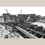 Fig. 20: Construction photo of the Santee-Cooper project showing cranes over the Pinopolis Power Plant. Photo courtesy of Santee Cooper.