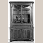 Fig. 118: Corner cupboard by Jesse Clodfelter, 1844, Davidson Co., NC. Walnut with tulip poplar and light-wood inlay; HOA: 86-1/4", WOA: 47-5/8", DOA: NR. Private collection. MESDA Object Database file S-2902.