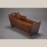 Fig. 85: Cradle attributed to a member of the Fawcett family, probably John Fawcett Sr. (1716–1786) or Richard Fawcett (d.1789), 1740–1760, Frederick Co., VA. Walnut; HOA (at headboard): 19-3/4”, WOA: 17-3/4”, DOA: 41-3/8”. Collection of the Museum of the Shenandoah Valley, Acc. 2017.04.1. Photograph by Ron Blunt.
