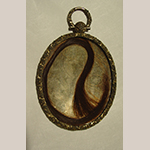 Fig. 6: Lock of hair held in the case of the miniature portrait shown in Fig. 4.
